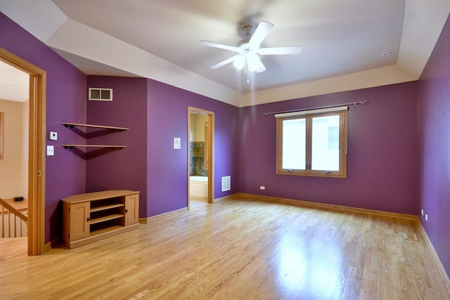 unfurnished bedroom featuring light wood finished floors, visible vents, and baseboards