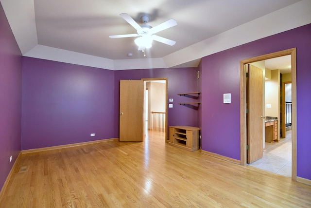 unfurnished bedroom with baseboards and wood finished floors