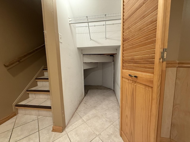 spacious closet featuring light tile patterned flooring