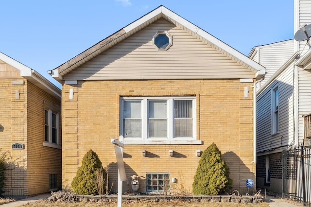 exterior space featuring brick siding