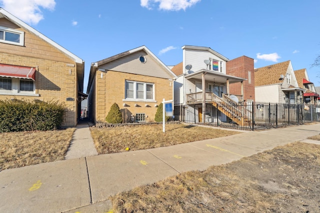 view of front of home featuring fence