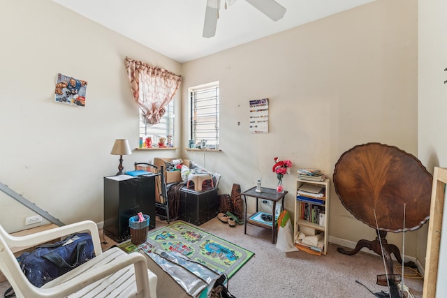 interior space with carpet and a ceiling fan