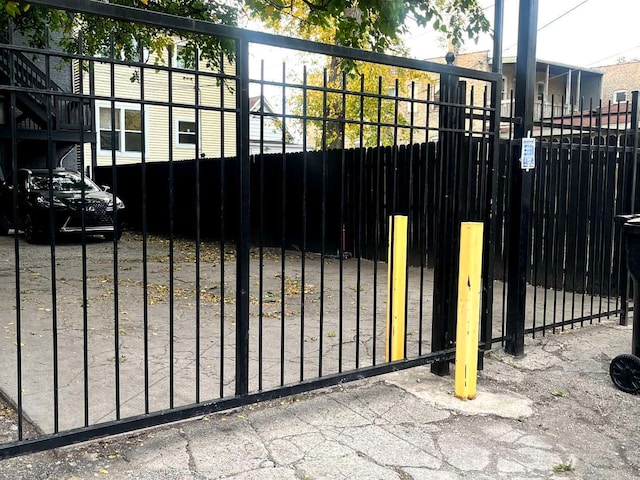 view of gate featuring fence