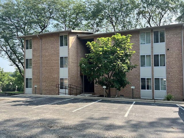 view of property with uncovered parking