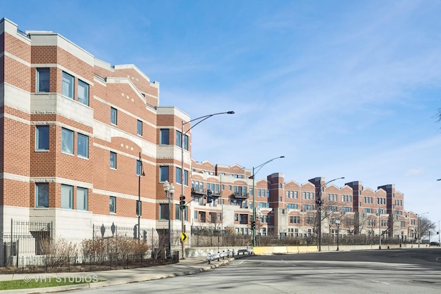 view of building exterior featuring fence