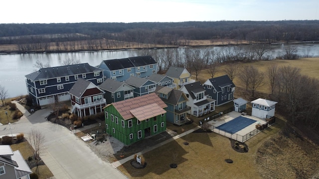 birds eye view of property with a water view, a forest view, and a residential view