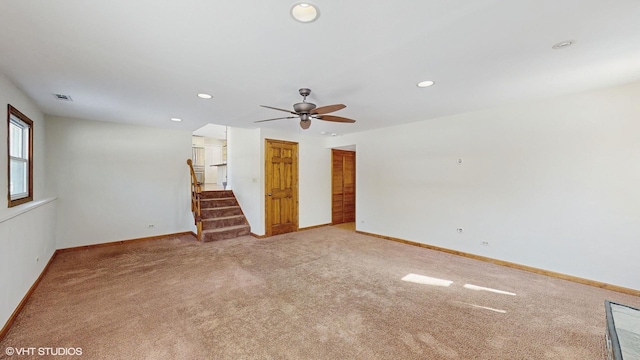 empty room featuring visible vents, baseboards, carpet, stairs, and recessed lighting