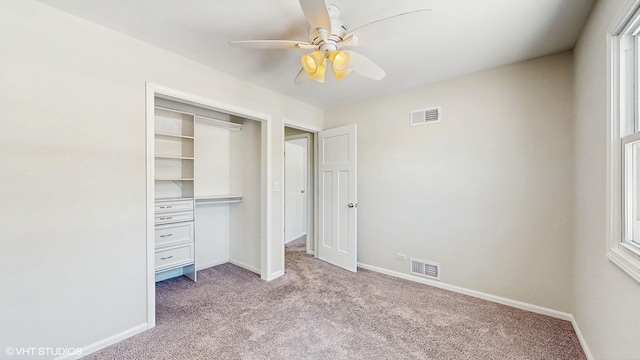 unfurnished bedroom featuring carpet, visible vents, and baseboards