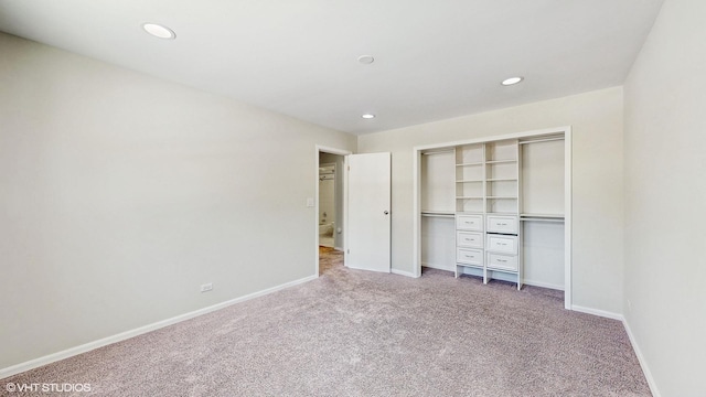 unfurnished bedroom with a closet, baseboards, carpet flooring, and recessed lighting