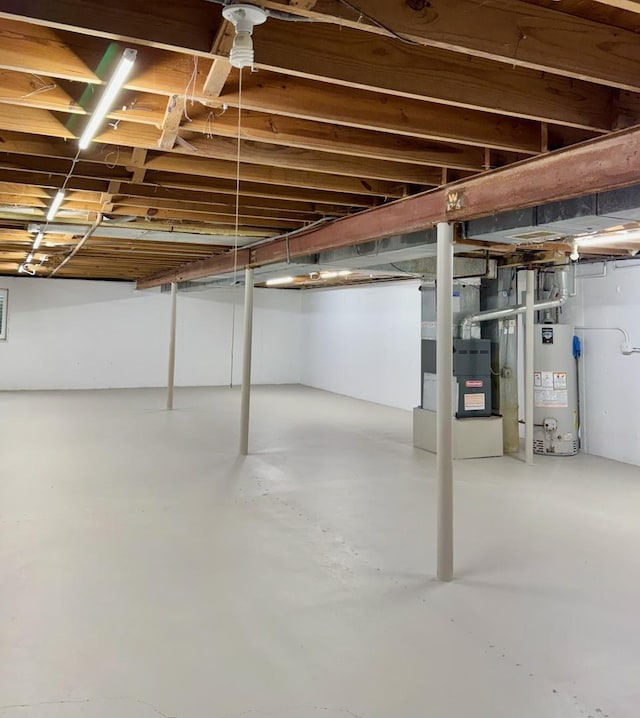 unfinished basement with gas water heater and heating unit