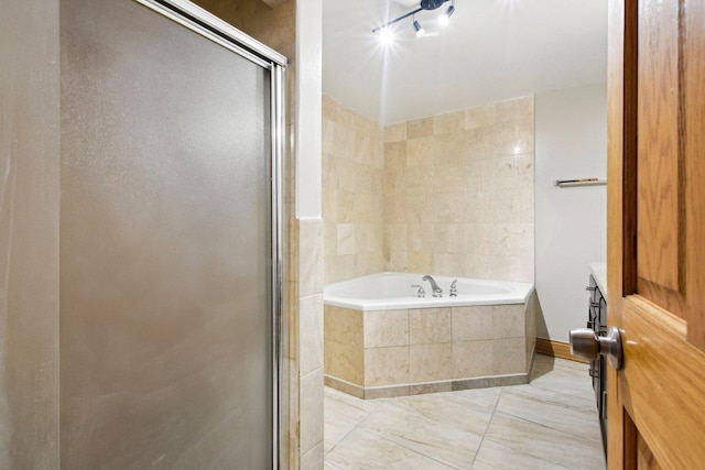 bathroom featuring a shower stall and a bath