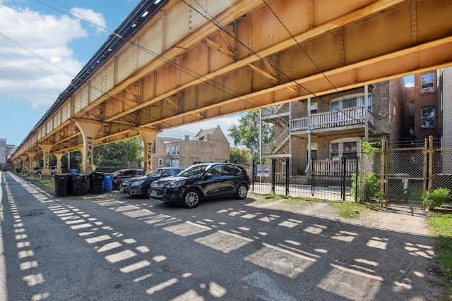 view of car parking featuring fence