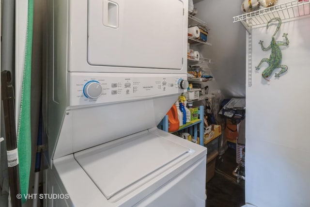 clothes washing area with laundry area and stacked washer / drying machine