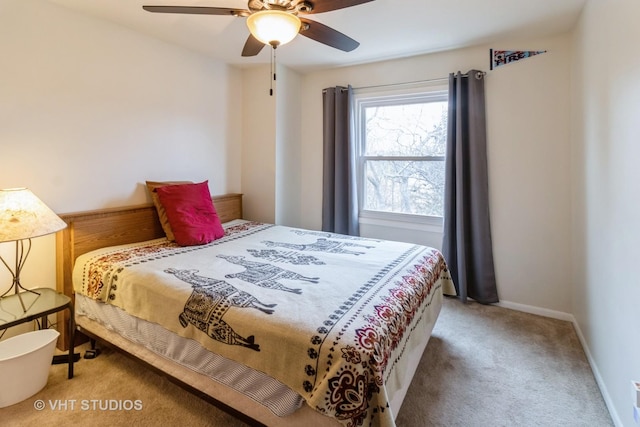 bedroom featuring carpet floors, a ceiling fan, and baseboards