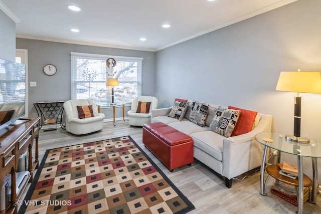 living room with ornamental molding, recessed lighting, baseboards, and wood finished floors