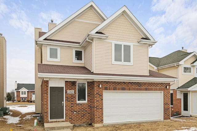 view of front of house featuring brick siding, a chimney, an attached garage, and central AC unit