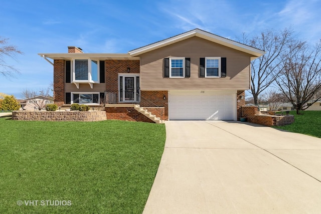 bi-level home with brick siding, driveway, a chimney, and a front yard