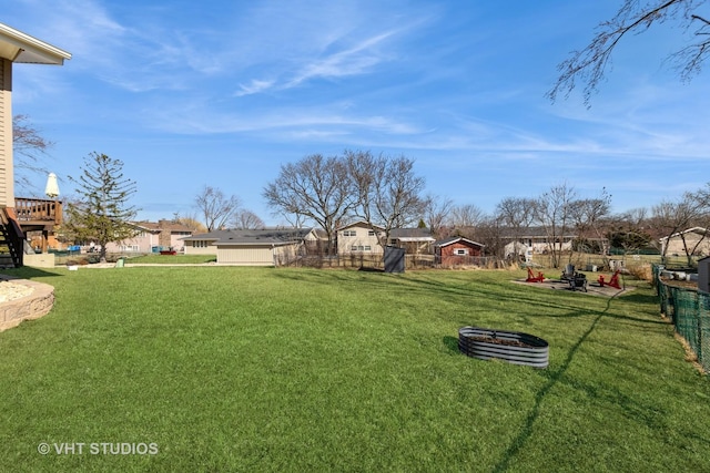 view of yard with a residential view and fence