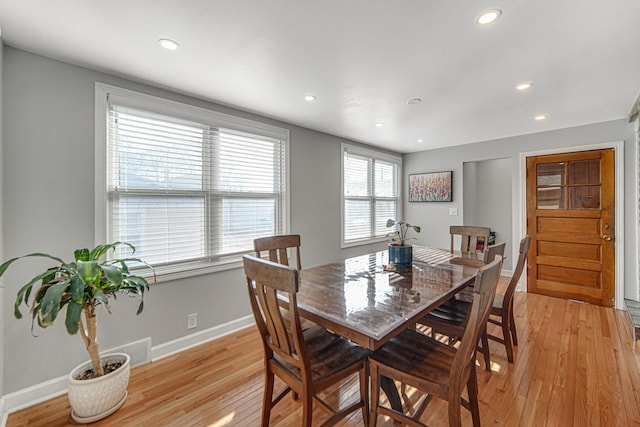 dining area featuring recessed lighting, light wood-style flooring, and baseboards