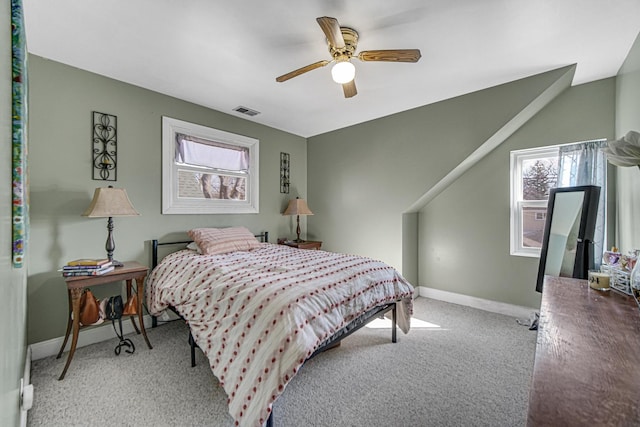 carpeted bedroom with baseboards, visible vents, and ceiling fan