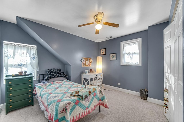 carpeted bedroom with ceiling fan, visible vents, and baseboards