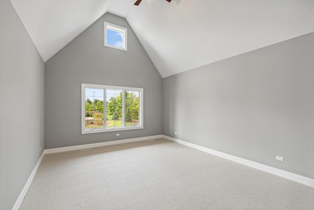 additional living space with ceiling fan, high vaulted ceiling, carpet, and baseboards