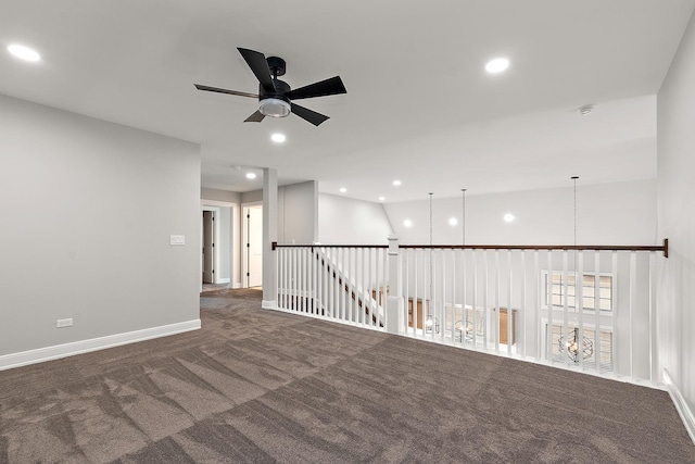 carpeted spare room featuring a ceiling fan, recessed lighting, and baseboards