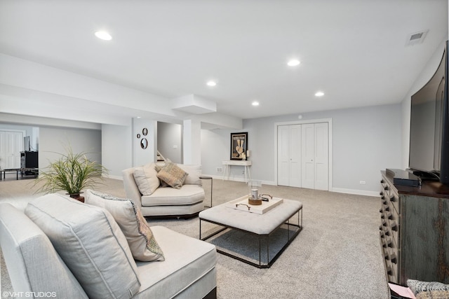 living area featuring recessed lighting, visible vents, baseboards, stairway, and carpet