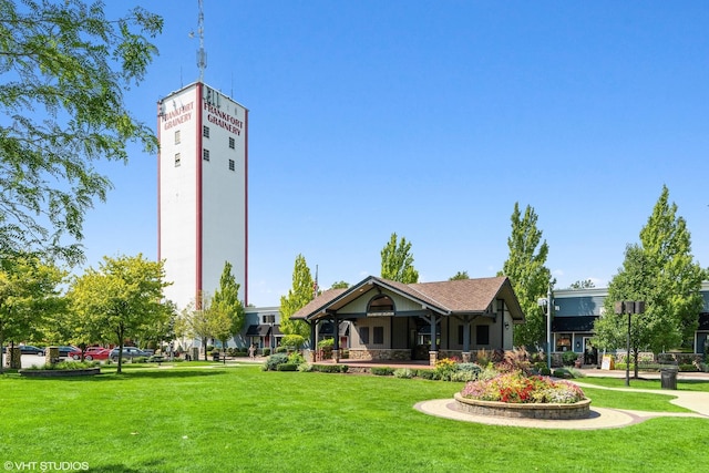 view of property's community with a lawn