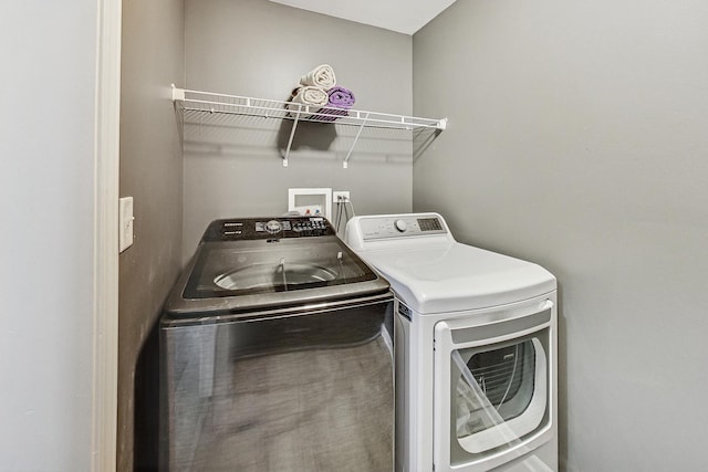 laundry room featuring laundry area and separate washer and dryer