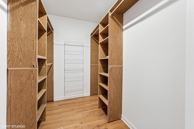 spacious closet with light wood-style floors