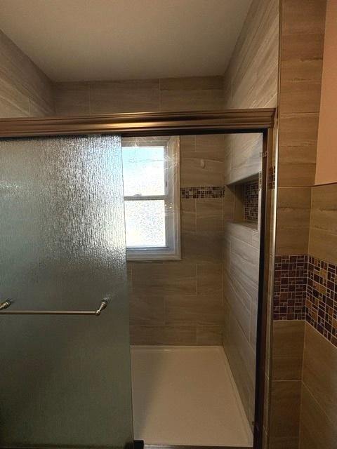 full bathroom featuring a shower stall