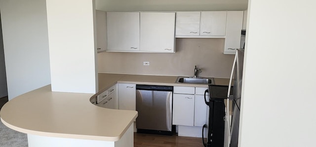 kitchen with a sink, a peninsula, light countertops, and stainless steel dishwasher