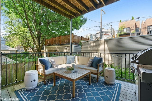 wooden deck featuring an outdoor hangout area