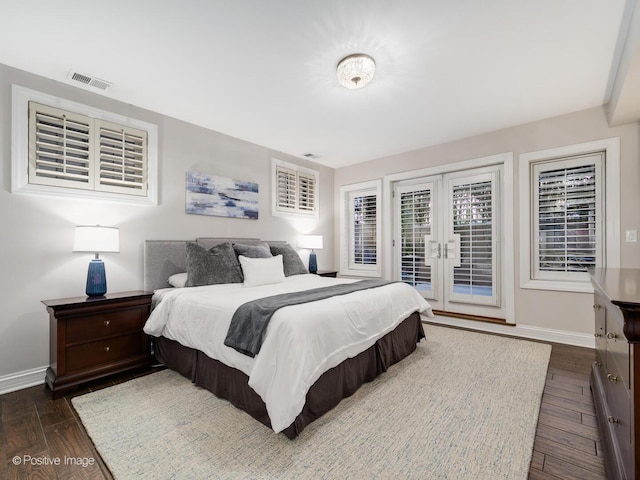 bedroom featuring visible vents, baseboards, access to exterior, french doors, and dark wood finished floors