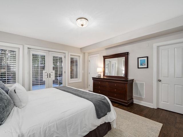 bedroom with baseboards, visible vents, dark wood-style flooring, access to outside, and french doors