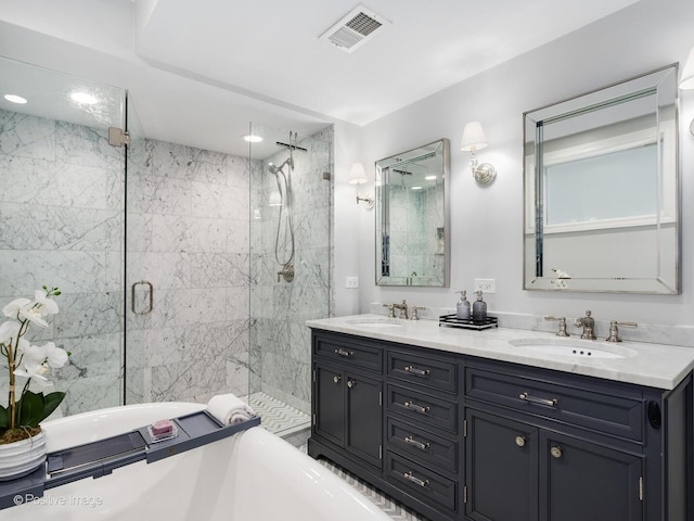 bathroom with double vanity, a sink, visible vents, and a shower stall