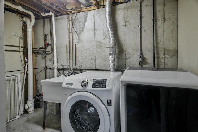 laundry room featuring a sink, laundry area, and washer and dryer