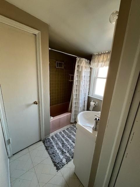 bathroom featuring tile patterned floors, visible vents, vanity, and shower / bath combination with curtain