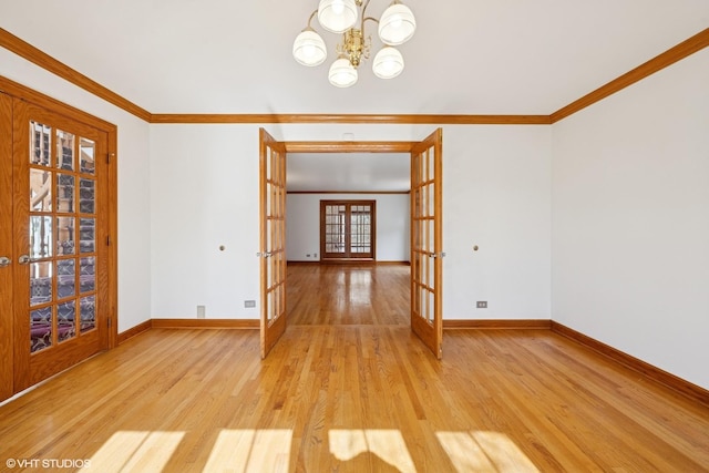 unfurnished dining area with french doors, baseboards, crown molding, and light wood finished floors