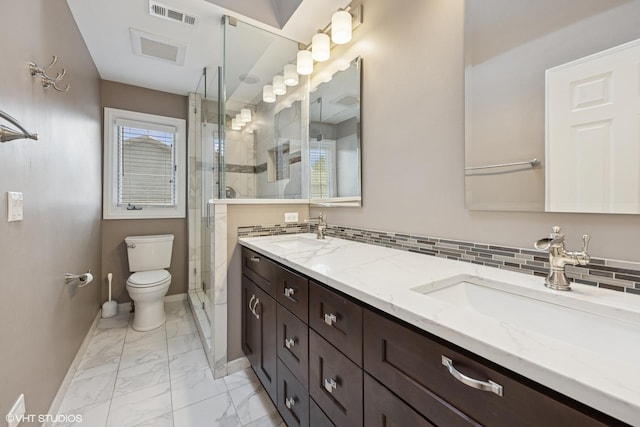 full bathroom with toilet, marble finish floor, a sink, and visible vents