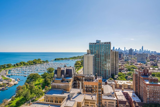 birds eye view of property featuring a view of city and a water view