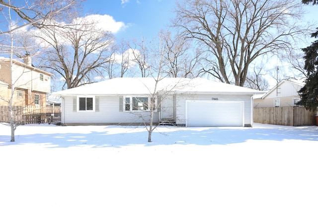 single story home featuring fence and an attached garage