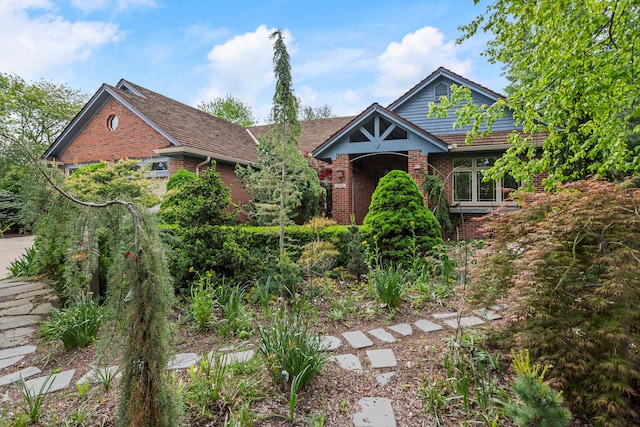 2806 Oakmont Ct, Champaign, IL 61821 - tudor-style house featuring brick siding