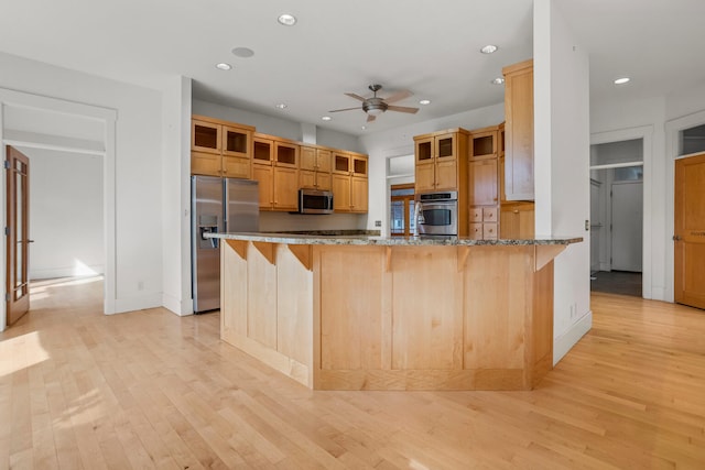 2806 Oakmont Ct, Champaign, IL 61821 - kitchen with appliances with stainless steel finishes, a ceiling fan, a peninsula, glass insert cabinets, and recessed lighting