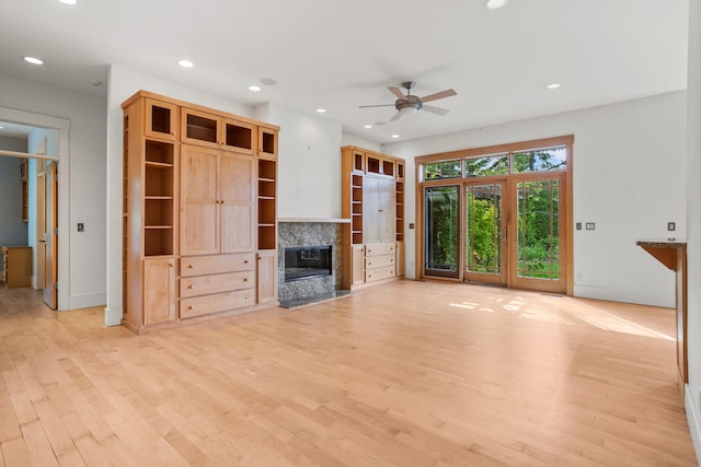 2806 Oakmont Ct, Champaign, IL 61821 - unfurnished living room with a ceiling fan, light wood-style flooring, a fireplace, recessed lighting, and baseboards