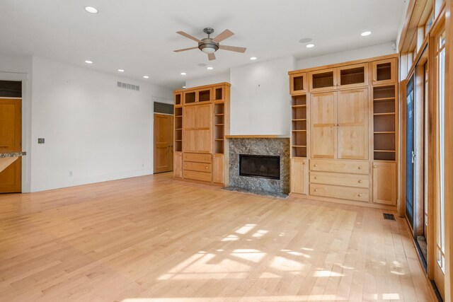 2806 Oakmont Ct, Champaign, IL 61821 - unfurnished living room featuring a ceiling fan, a high end fireplace, light wood-type flooring, and recessed lighting