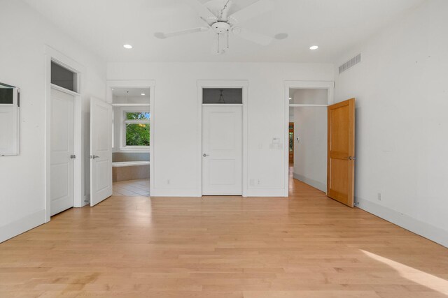 2806 Oakmont Ct, Champaign, IL 61821 - unfurnished bedroom featuring light wood-type flooring, recessed lighting, ensuite bath, two closets, and baseboards