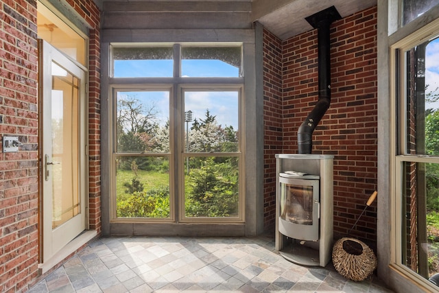 2806 Oakmont Ct, Champaign, IL 61821 - unfurnished sunroom with a wood stove