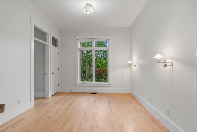 2806 Oakmont Ct, Champaign, IL 61821 - unfurnished bedroom with baseboards and light wood-type flooring